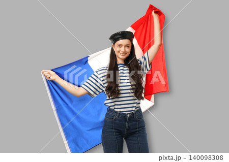Young woman holds France flag, expressing joy and pride Young woman holds France flag, expressing joy and pride 140098308