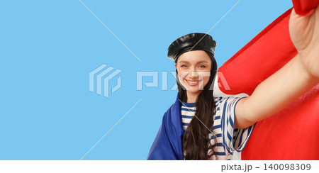 Woman showcases flag representing nation. Celebration and travel concepts 140098309