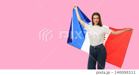 Woman waves French flag, expressing joy in vibrant space 140098311