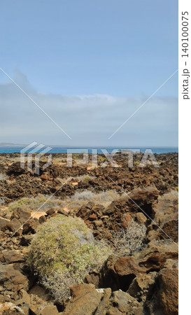 Wide view of Lanzarote desert landscape with volcanic hills and stark island beauty 140100075