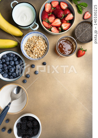 Healthy breakfast ingredients yogurt berries granola Healthy breakfast ingredients yogurt berries granola 140100225