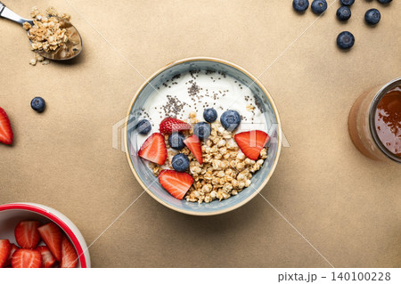 Healthy breakfast bowl yogurt berries granola 140100228