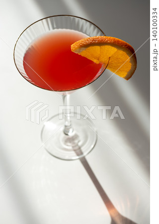 Martini Fiero Cocktail with Orange Fruit. Vibrant Aperitif 140100334