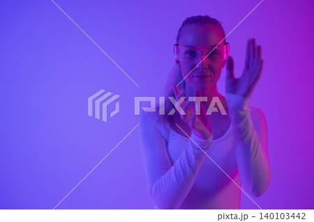 Futuristic Woman in Neon Lighting Futuristic Woman in Neon Lighting 140103442