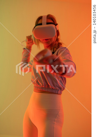 Woman immersed in virtual reality 140103456