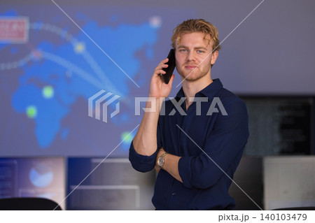Confident cybersecurity analyst discusses strategies in a high-tech SOC environment Confident cybersecurity analyst discusses strategies in a high-tech SOC environment 140103479