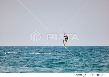 Nha Trang, Khanh Hoa, Vietnam - April 4, 2026: Kitesurfer Performing High Jump Above Waves in Nha Trang Nha Trang, Khanh Hoa, Vietnam - April 4, 2026: Kitesurfer Performing High Jump Above Waves in Nha Trang 140104089