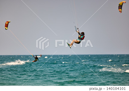 Nha Trang, Khanh Hoa, Vietnam - April 5, 2026: Kitesurfer Performing High Jump Above Waves in Nha Trang Nha Trang, Khanh Hoa, Vietnam - April 5, 2026: Kitesurfer Performing High Jump Above Waves in Nha Trang 140104101