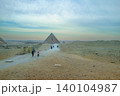 Tourists Walking Towards Pyramids of Giza in Cairo Egypt 140104987
