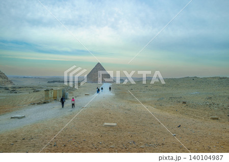 Tourists Walking Towards Pyramids of Giza in Cairo Egypt 140104987