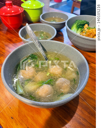 Bowl of meatball soup with greens and clear broth meatball traditional Bowl of meatball soup with greens and clear broth meatball traditional 140105216