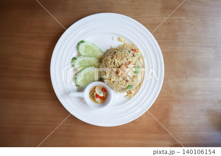 stir fried rice or fried rice with cashew nut topping and cucumber stir fried rice or fried rice with cashew nut topping and cucumber 140106154