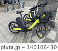 Bicycles parked on the street near a bike-sharing station in a city center during the daytime 140106430