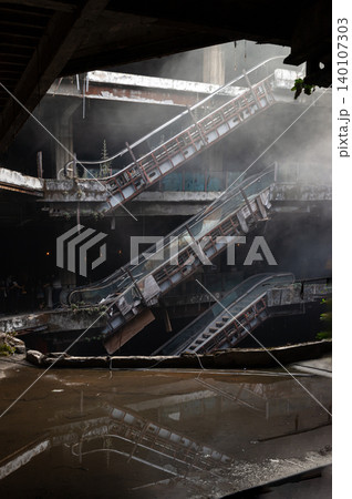 a ghostly haze drifts through a decaying, multi-tiered atrium, where the skeletal remains of rusted escalators slice across a dark void and reflect flawlessly in a pool of stagnant rainwater below. 140107303