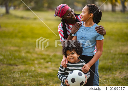 African american family enjoying outdoor activity in park 140109917