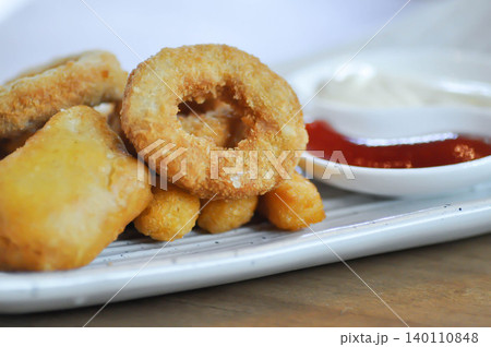 caramari and Chicken Nugget or fried chicken , crispy chicken or fried squid or onion ring caramari and Chicken Nugget or fried chicken , crispy chicken or fried squid or onion ring 140110848