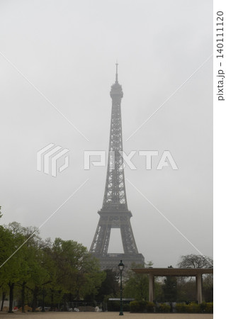 Low visibility view of Eiffel Tower in heavy fog, moody weather in Paris 140111120
