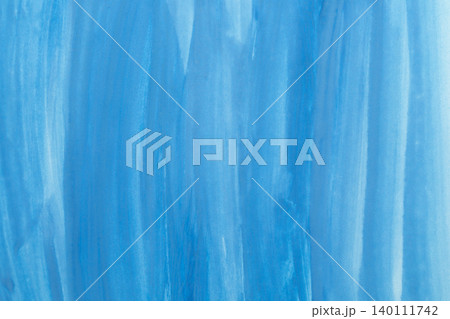 Abstract blue watercolor background. The color splashing on the paper. Hand drawn. 140111742