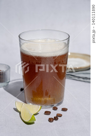 Coffee bomb with sparkling water and espresso shot, trendy summer coffee drink 140111890