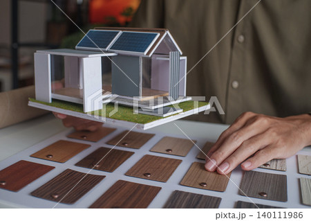 Architecture or Interior Designer Choosing Interior Materials for House. Architecture or Interior Designer Choosing Interior Materials for House. 140111986