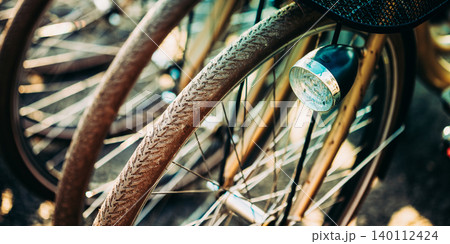 Bicycle Wheels and Headlight Detail Bicycle Wheels and Headlight Detail 140112424