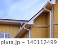 Yellow Hardie siding new house rooflines, edges gutter details, 140112499