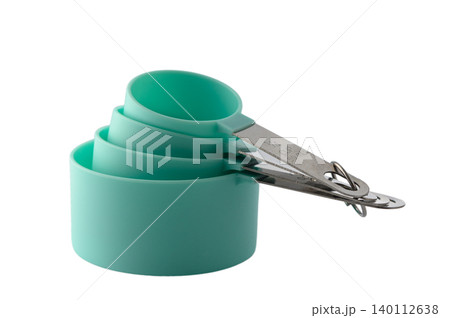 Set of green kitchen measuring cups isolated on white background Set of green kitchen measuring cups isolated on white background 140112638