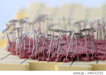 Blocking Knitted Fabric with Pins Process Isolated on White Background 140112721
