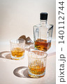 Whiskey with ice in glasses 140112744