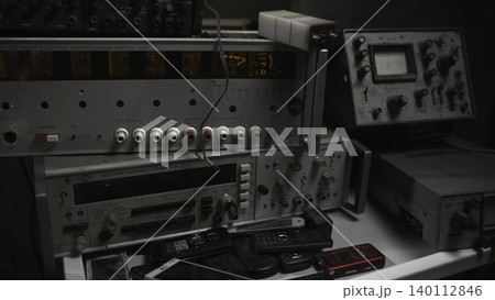 Old Audio Equipment And Workspace. Salvage Workshop Showcasing Classic Audio Gear And Repair Tools . Media 140112846