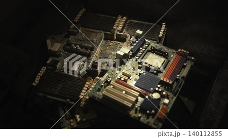 Closeup Of Computer Mainboard Details. Detailed Shot Of Motherboard Components Illuminated By Spotlight. Media 140112855