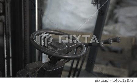 Worn Rubber Grips On Warehouse Machinery. Industrial Forklift Steering And Control Levers In Warehouse . Media Worn Rubber Grips On Warehouse Machinery. Industrial Forklift Steering And Control Levers In Warehouse . Media 140112872