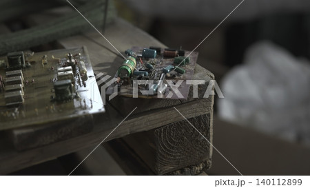 Focus On Electronic Modules Placed On Wooden Pallet With Workshop Lighting And Soldering Marks . Media Focus On Electronic Modules Placed On Wooden Pallet With Workshop Lighting And Soldering Marks . Media 140112899