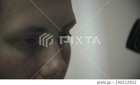 An Individual Woman Carefully Studies Detailed Microscopic Images During Laboratory Data Analysis Process . Stock clip 140112912
