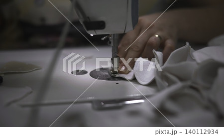 Sewing Machine Action. Presser Foot And Needle Collaborate To Produce Uniform Seams Efficiently. Media 140112934