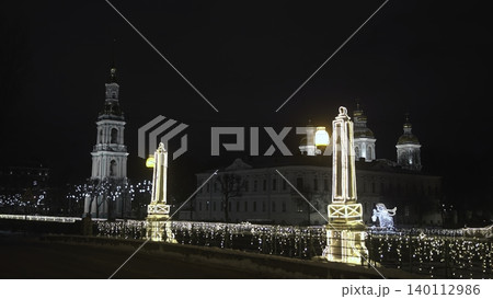 Festive Urban Bridge Display. Elegant City Bridge Glowing With Holiday Lights And Bustling Pedestrians. Media 140112986