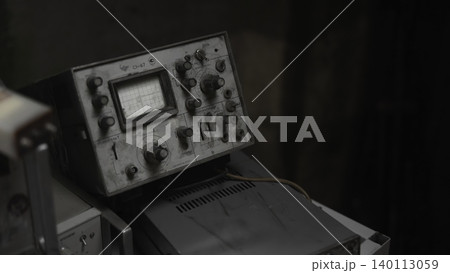 Closeup Of Vintage Instrument Controls. Workshop Scene Showing Dusty Knobs And Dials With Worn Labels . Media 140113059