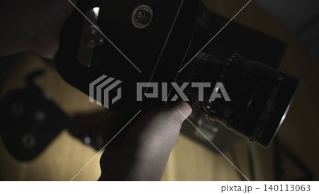 Skilled Technician Meticulously Calibrates Focus And Aperture Under Controlled Studio Lighting Conditions . Media 140113063