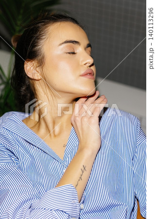 Young woman showing natural beauty and glowing skin Young woman showing natural beauty and glowing skin 140113296
