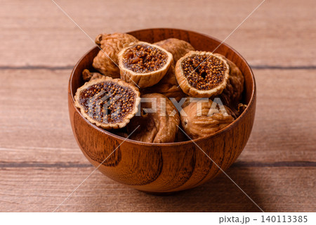 Dried whole fig as an ingredient for sweet desserts. Dried figs Dried whole fig as an ingredient for sweet desserts. Dried figs 140113385