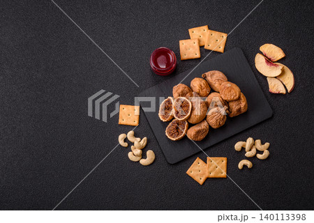 Dried whole fig as an ingredient for sweet desserts. Dried figs Dried whole fig as an ingredient for sweet desserts. Dried figs 140113398