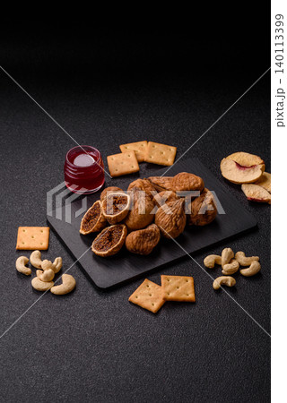 Dried whole fig as an ingredient for sweet desserts. Dried figs Dried whole fig as an ingredient for sweet desserts. Dried figs 140113399