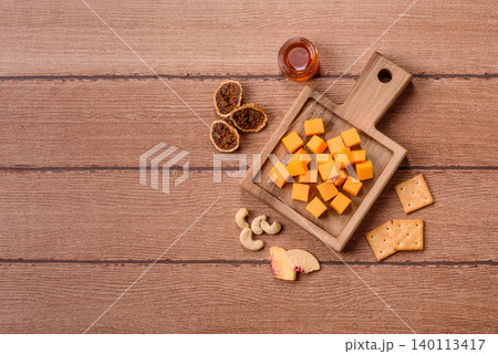 Hard yellow cheddar cheese for sandwiches or pasta. Cheddar cheese 140113417