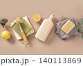 Eco cleaning supplies with lemon bottle and microfiber cloths 140113869
