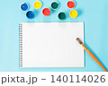 Back to school. Colorful paints, album and brush on punchy blue. 140114026