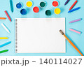Back to school. Colorful paints, album and brush on punchy blue. 140114027