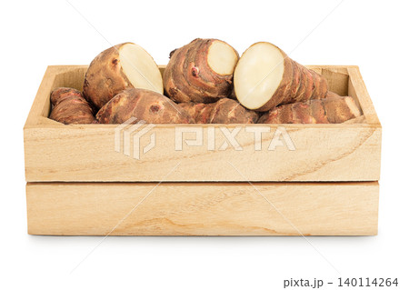 Jerusalem artichoke in a wooden box isolated on white background Jerusalem artichoke in a wooden box isolated on white background 140114264