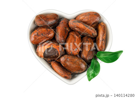 cocoa beans in ceramic bowl isolated on white background. Top view. Flat lay cocoa beans in ceramic bowl isolated on white background. Top view. Flat lay 140114280