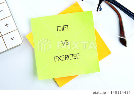 Sticky notes labeled diet and exercise sit on a desk alongside a calculator and glasses, symbolizing the daily choices for health and fitness management Sticky notes labeled diet and exercise sit on a desk alongside a calculator and glasses, symbolizing the daily choices for health and fitness management 140114414