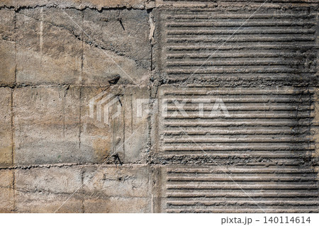 Textured Concrete Wall with Ribbed Grooves and Rusty Nails Textured Concrete Wall with Ribbed Grooves and Rusty Nails 140114614
